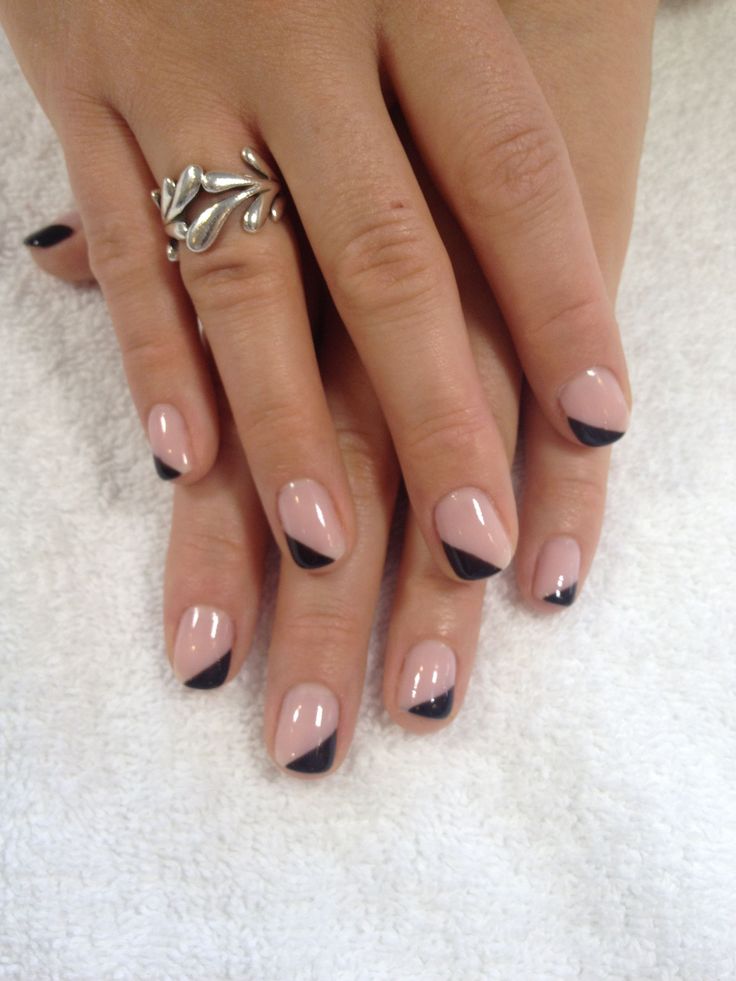 Edgy Chic: Modern French Manicure with Triangular Tips and Silver Accents