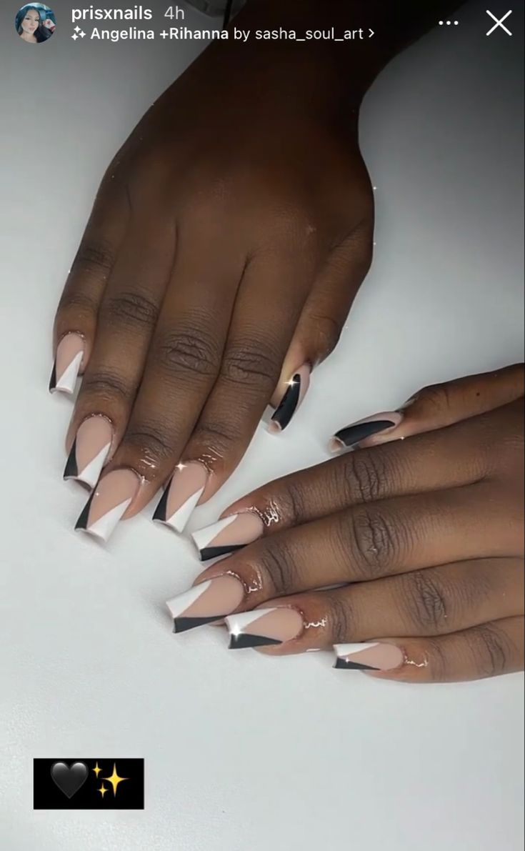 Chic Nude Nail Design with Bold Black and White Accents and Elegant Gold Details