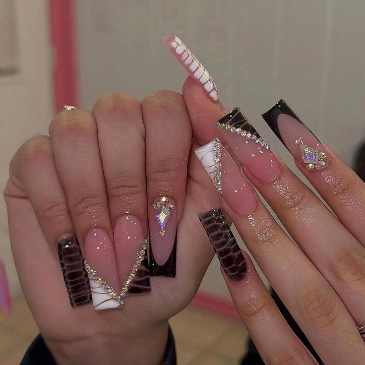 Trendy Nail Design with Glossy Pink, Bold Black, and Elegant White Accents.