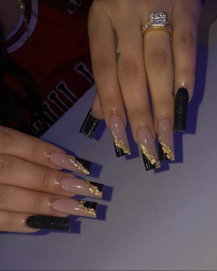 Sophisticated Elegance: Long Square Nail Design with Nude and Black Finishes and Gold Foil Accents.