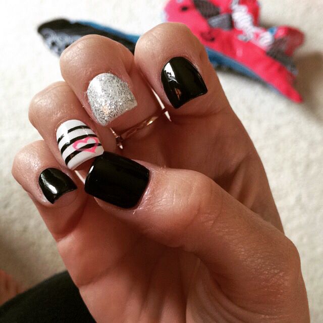 Stylish Nail Design: Bold Black and Silver Accents with Playful Stripes and Hearts.