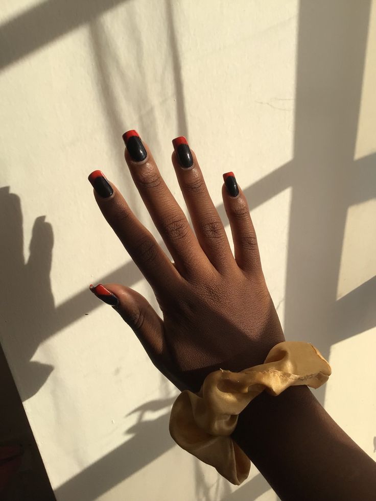 Bold Black and Red Nail Design Accented with a Chic Golden Scrunchie.