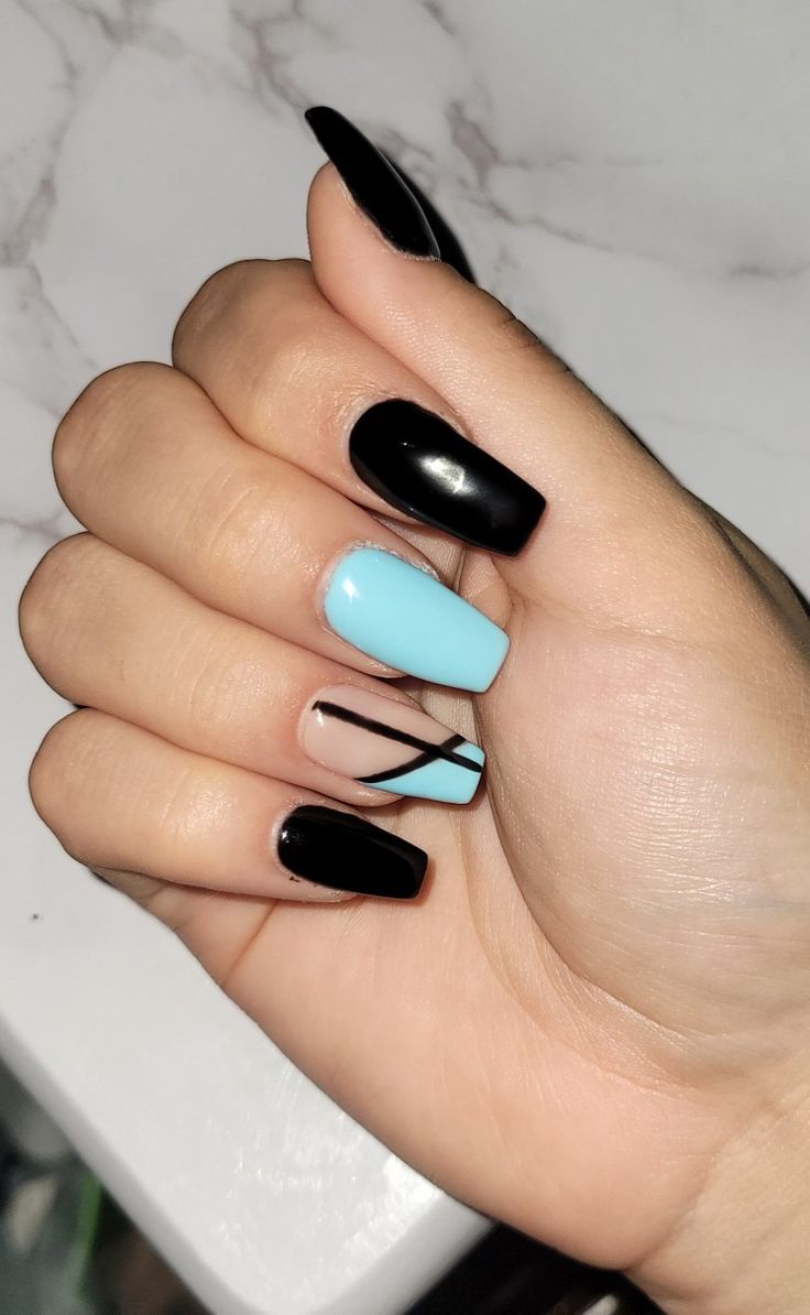 Chic Nail Design: Glossy Black and Soft Blue with Geometric Accents