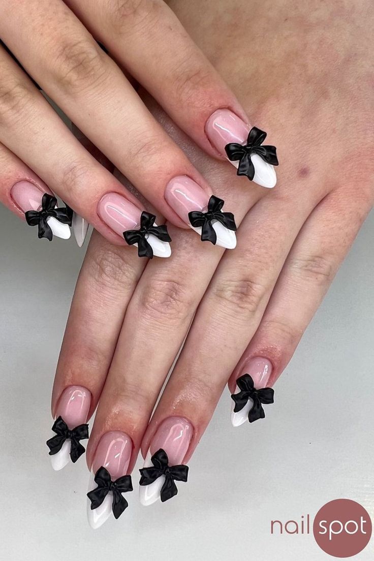 Elegant Chic Nail Design with Playful Bows and Contrasting Color Palette.