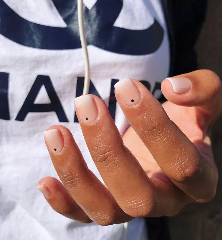 Elegant Minimalist Nail Design with Nude Base and Black Dot Accents