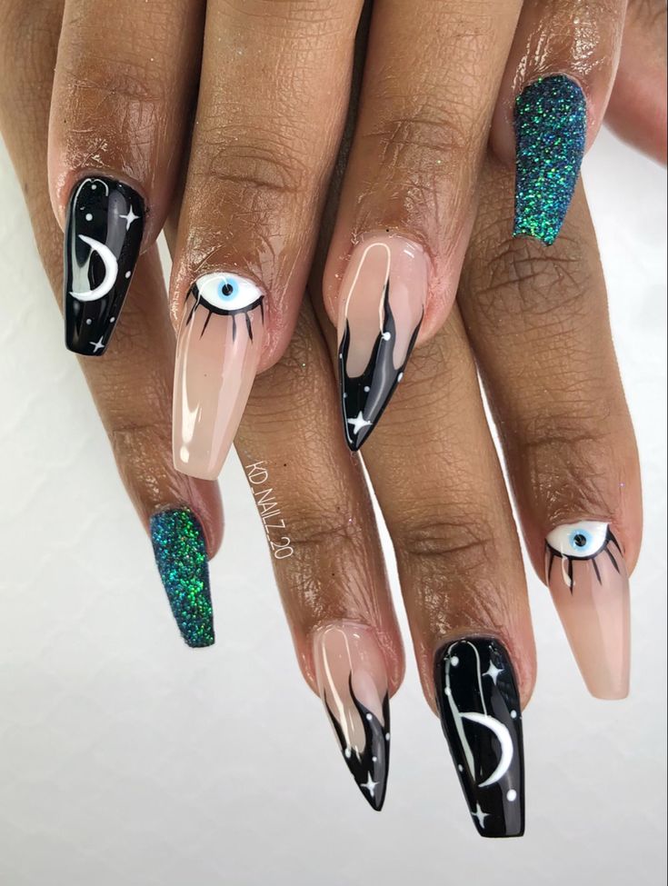 Captivating Nail Design with Mystical Accents and Glossy Glamour.