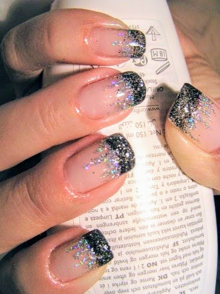 Elegant Sparkly Gradient Nails with Black Tips and Silver Glitter for Festive Glamour.