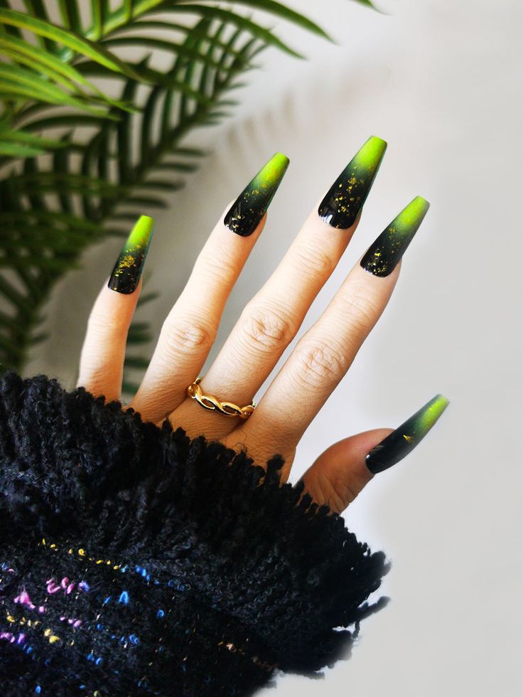 Vibrant Gradient Stiletto Nails with Glittering Accents for Bold Glamour.