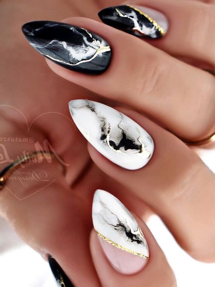 Chic Black and White Marble Nail Design with Gold Accents