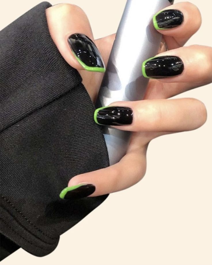 Chic Black Base with Vibrant Green Tips: A Modern Nail Design Statement.