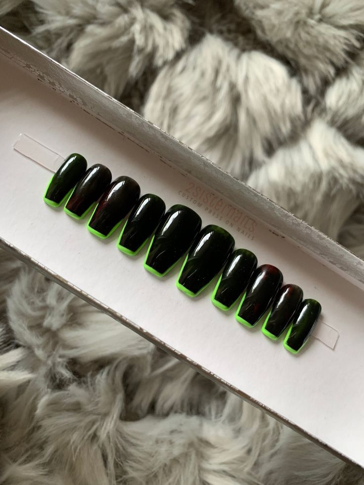 Striking Black and Neon Green Nail Design: A Sophisticated Yet Playful Look.