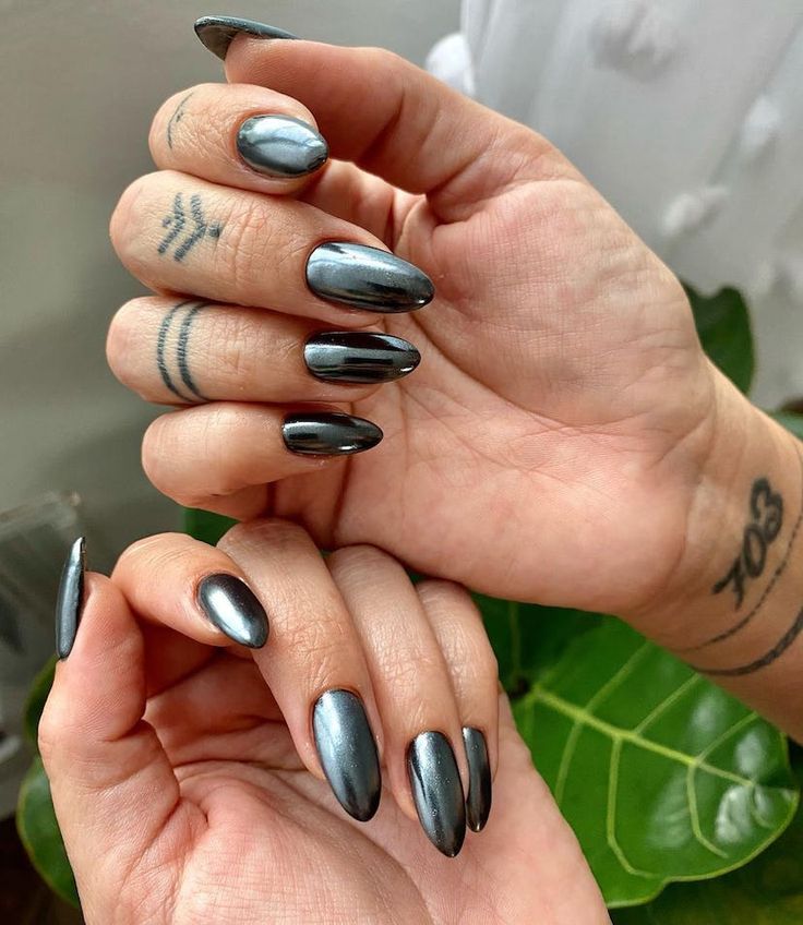 Elegant Chrome Almond Nails: A Bold, Stylish Statement in Deep Gray.