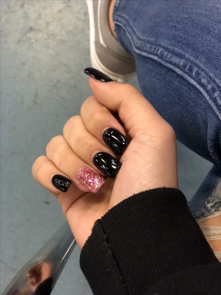 Chic Black and Pink Glitter Nail Design for Any Occasion.