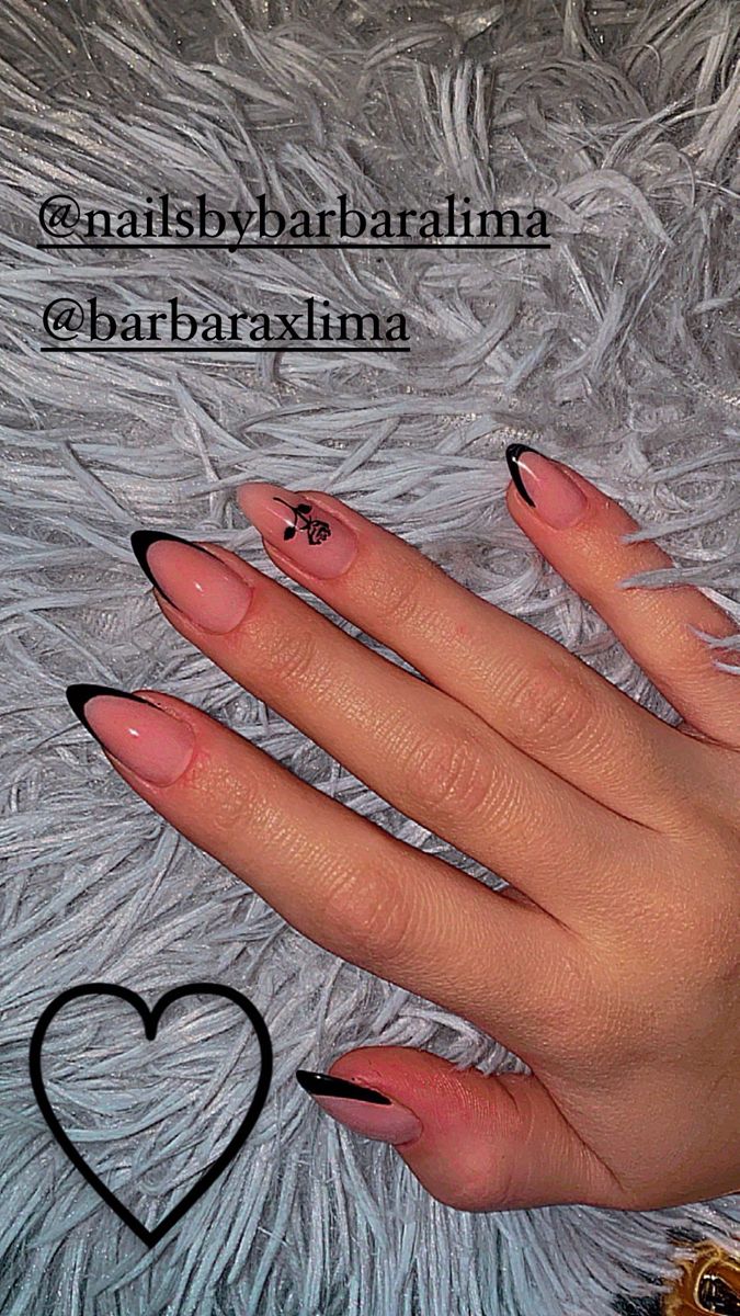 Chic Nail Design: Elegant Nude and Black with Artistic Floral Accents