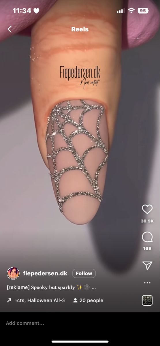 Elegant Spiderweb Nail Design: Sleek Nude Base with Striking Silver Detailing for Halloween.