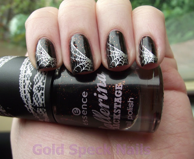 Bold Gothic-Inspired Nail Design with Dark Base, Intricate Spiderwebs, and Sparkling Glitter Accents.