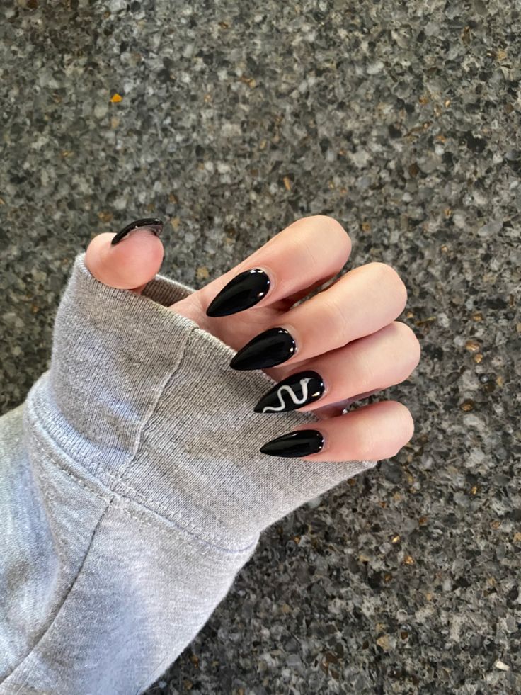 Striking Black Almond Nails with Minimalist White Snake Design.