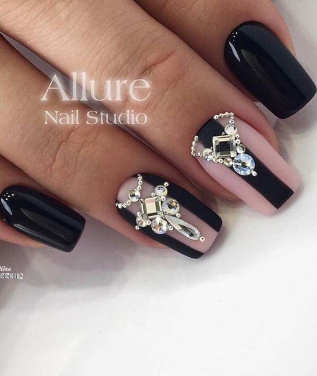 Chic Black and Nude Nail Design with Glamorous Rhinestone Embellishments