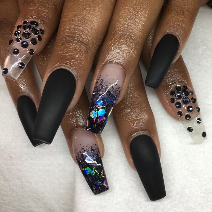 Bold Matte Black Nails with Glamorous Glitter Accents and Textured Embellishments for Any Occasion.