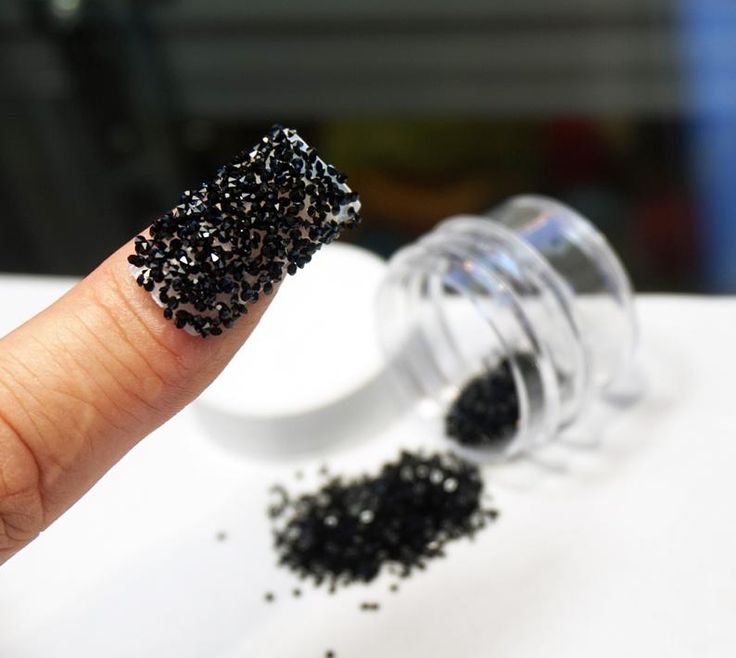 Bold Textured Black Nail Design with Tiny Beads for a Striking Statement.