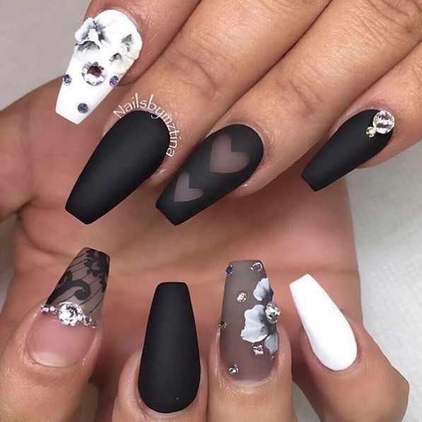 Sophisticated Nail Art Featuring Matte Black, Glossy Finishes, and Intricate 3D Embellishments.