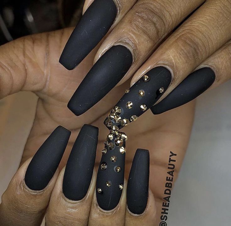 Chic Matte Black Nails with Glamorous Rhinestone Accent Design