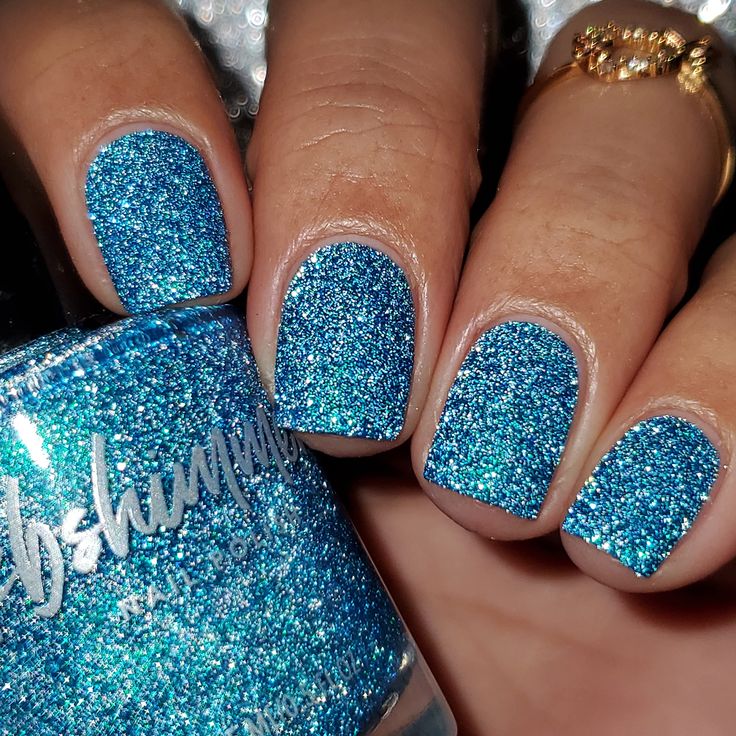 Glamorous Sparkling Blue Glitter Nail Design for Special Occasions.