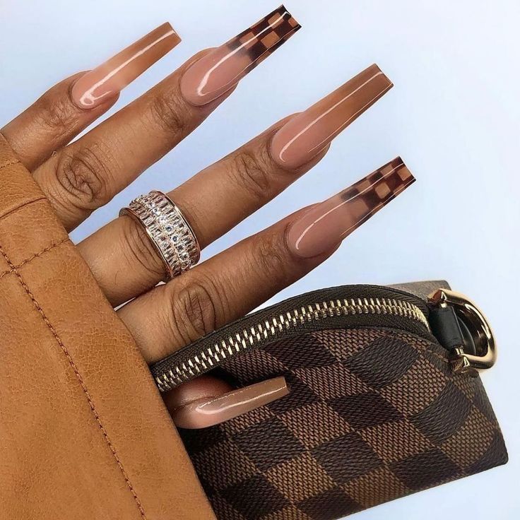 Chic Almond-Shaped Nails with Nude Base and Checkerboard Tips for a Luxe Look.