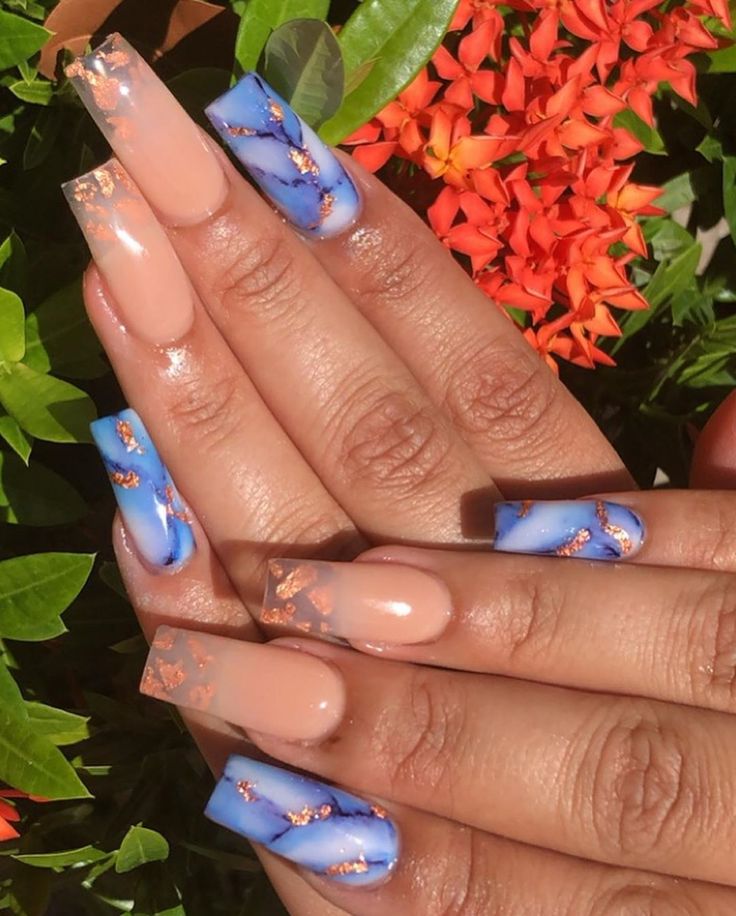 Chic Nude and Blue Marble Nail Design with Glamorous Rose Gold Accents