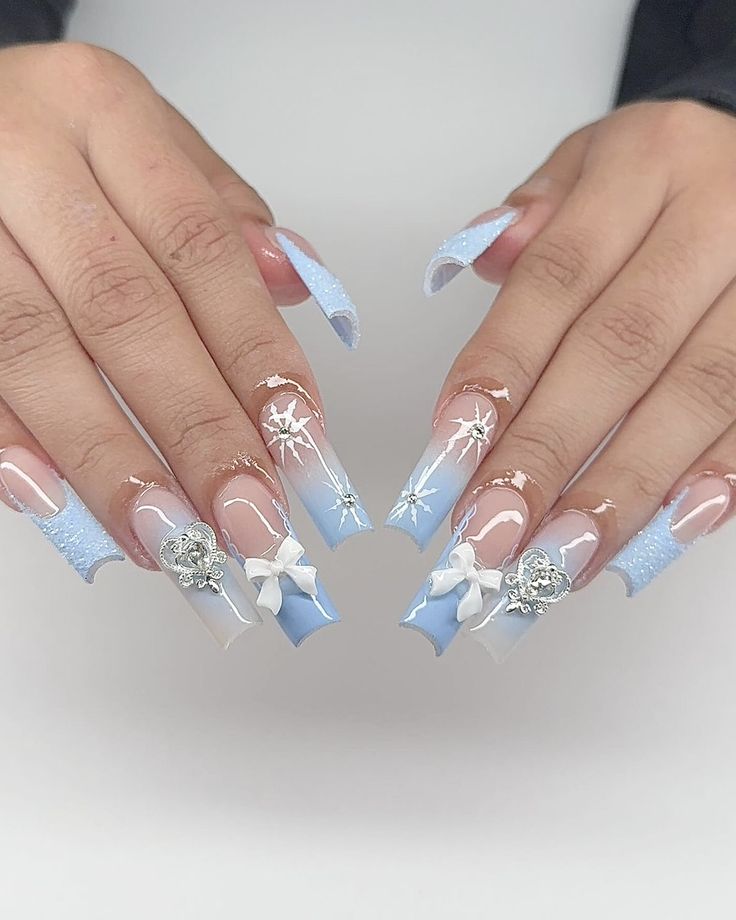 Chic Gradient Nail Design with Floral Motifs and Sparkling Embellishments.