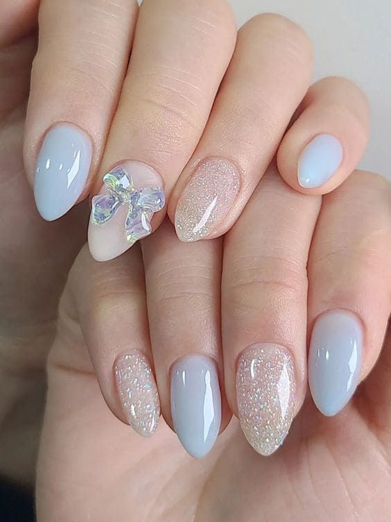 Elegant Pastel Nail Design with Floral Accent and Glossy Glitter Finishes