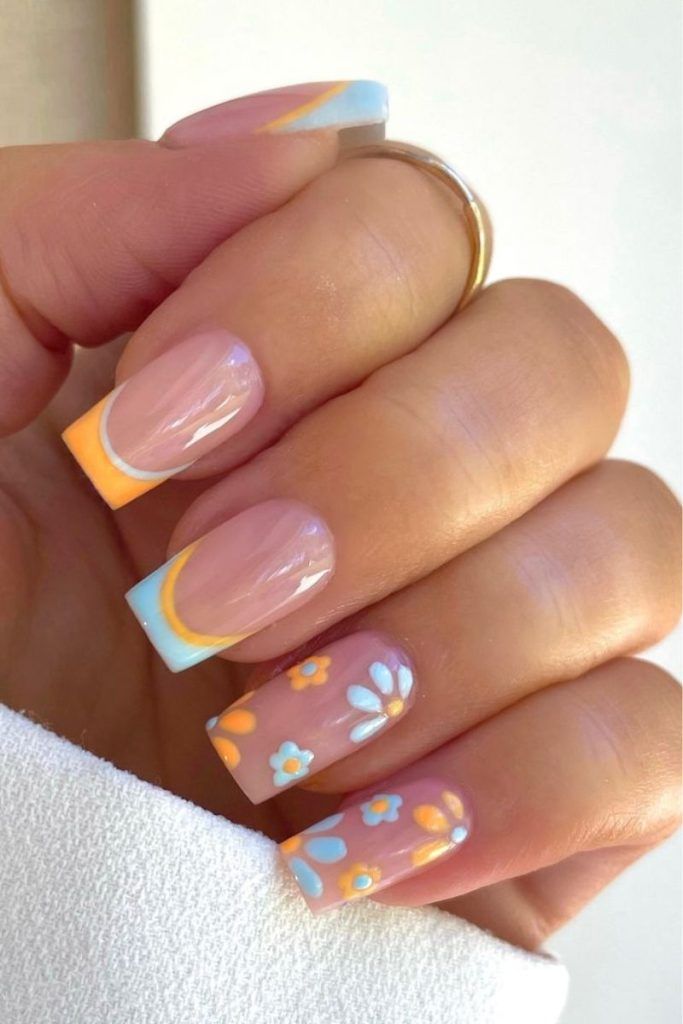 Spring-Inspired Pastel Gradient Nail Design with Floral Accents.