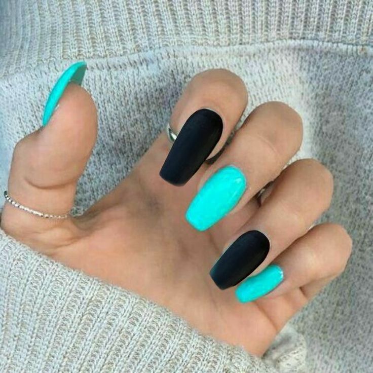 Bold Matte Black and Turquoise Nail Design: A Striking Contrast Against Cozy Sweater Styles.