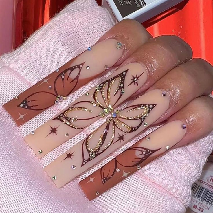 Captivating Butterfly Nail Design with Intricate Patterns and Glamorous Accents.