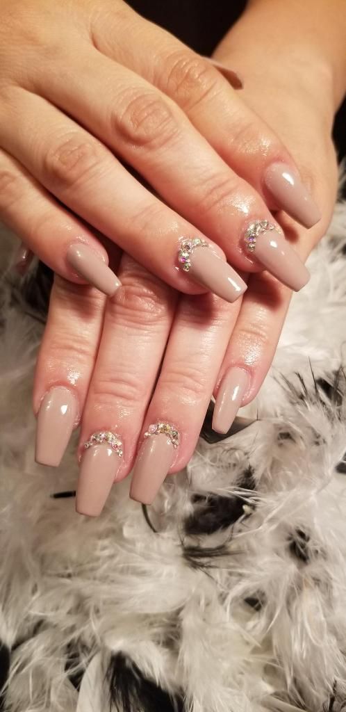 Sophisticated Beige Nail Design with Sparkling Gem Accents