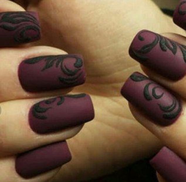 Sophisticated Matte Burgundy Nails with Intricate Black Floral Designs for a Bold Statement.