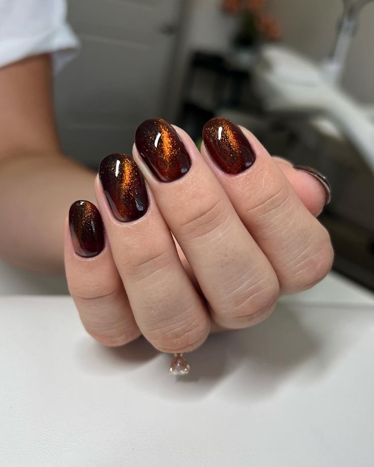 Warm Burgundy and Shimmering Bronze Ombre Gradient Nail Design for Autumn Elegance.