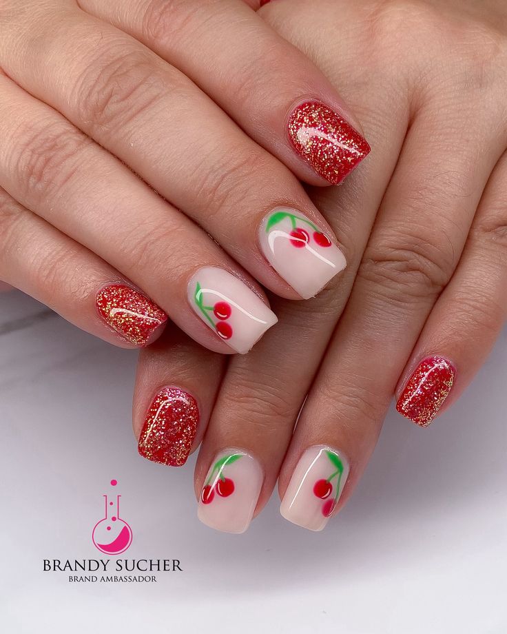 Vibrant Cherry-Inspired Nail Design with Glitter and Hand-Painted Motifs for a Cheerful Summer Look.