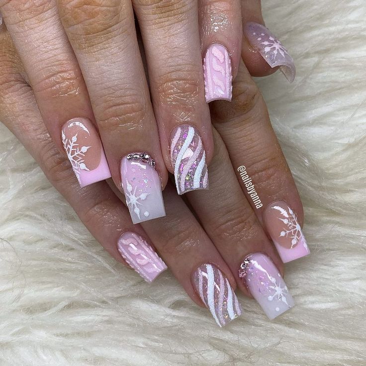 Elegant Soft Pink Nail Design with Intricate Patterns and Sparkling Rhinestones.