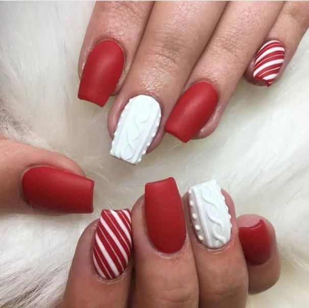 Festive Red and White Nail Design: A Stylish Blend of Matte, Textured Finishes, and Creative Patterns.