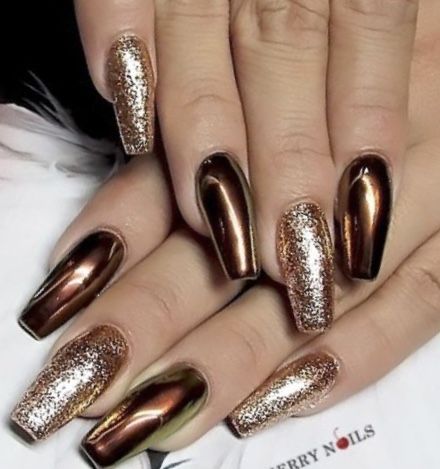 Luxurious Metallic Bronze Nail Design with Glossy and Glittery Finishes.