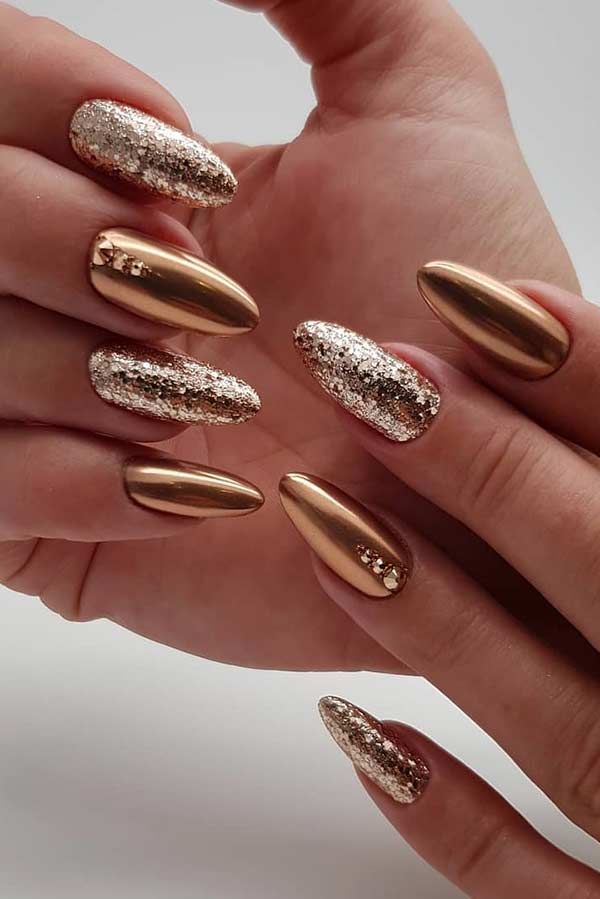 Sophisticated Metallic and Glitter Nail Design with Warm Gold Accents for Glamorous Occasions.