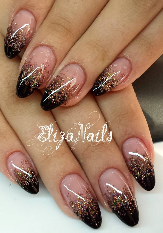 Elegant Gradient French Tips: A Bold Black and Glitter Contrast on a Nude Base.