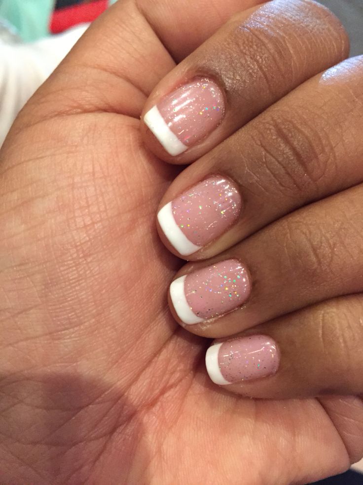 Elegant Glistening French Manicure with Soft Pink Base and Glitter Accents