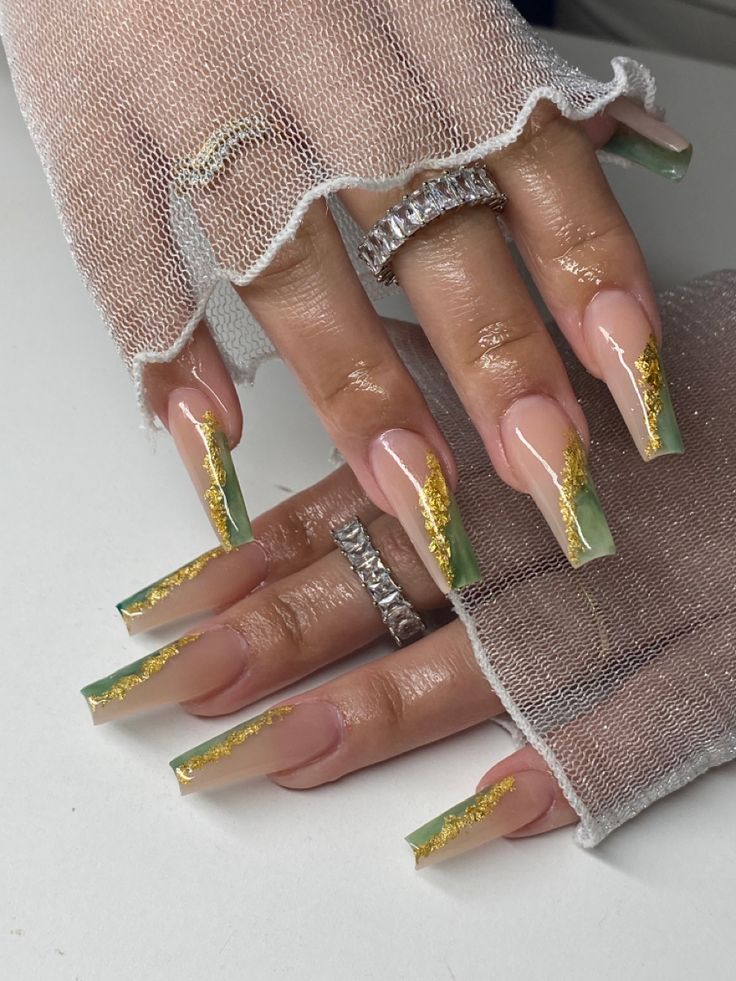 Sophisticated Gradient Nail Design with Soft Green Tips and Gold Foil Accents