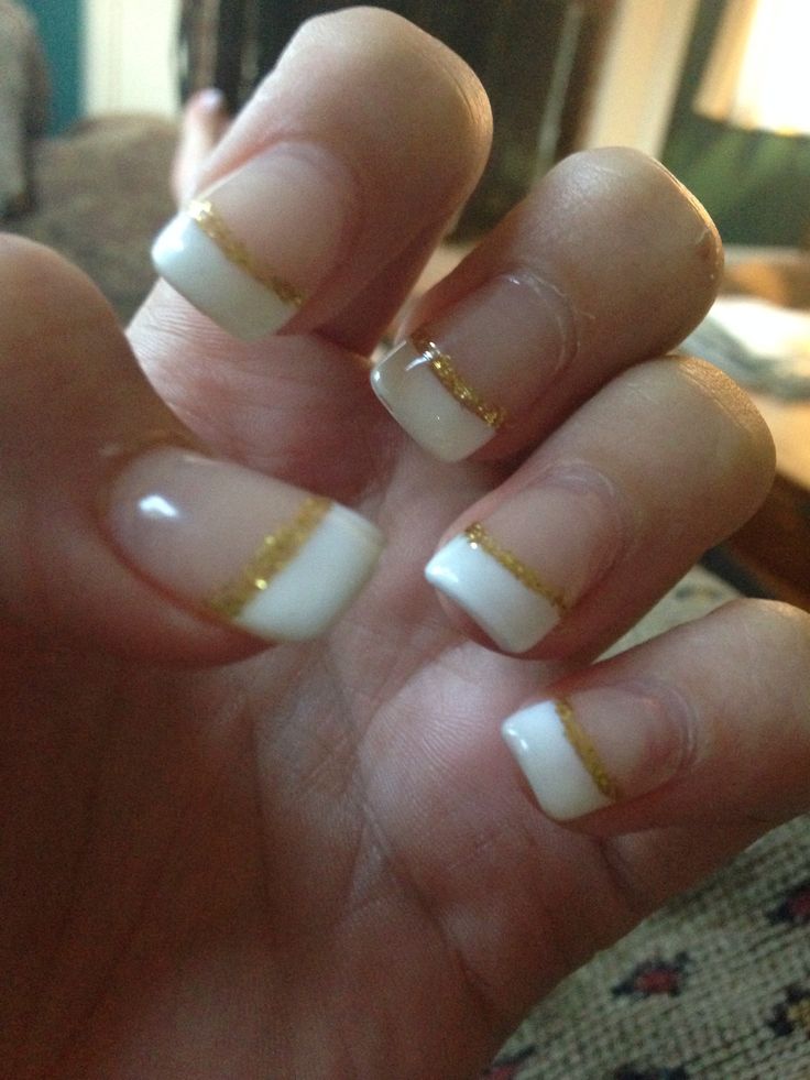 Sophisticated French Manicure with Glittering Gold Accents