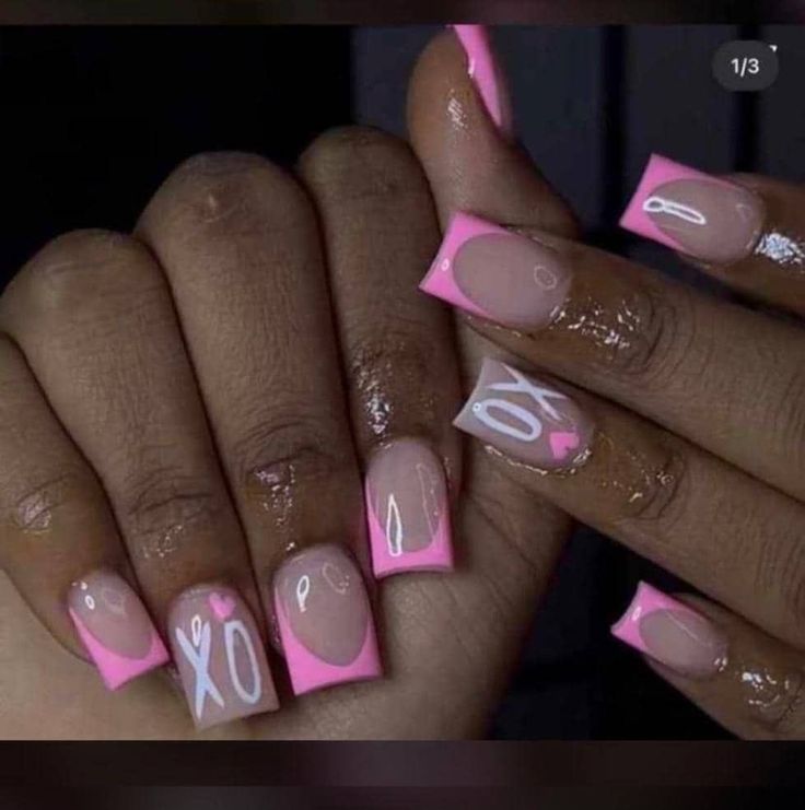 Trendy Colorful Nail Design: Nude and Vibrant Pink with Whimsical Heart and Letter Motifs