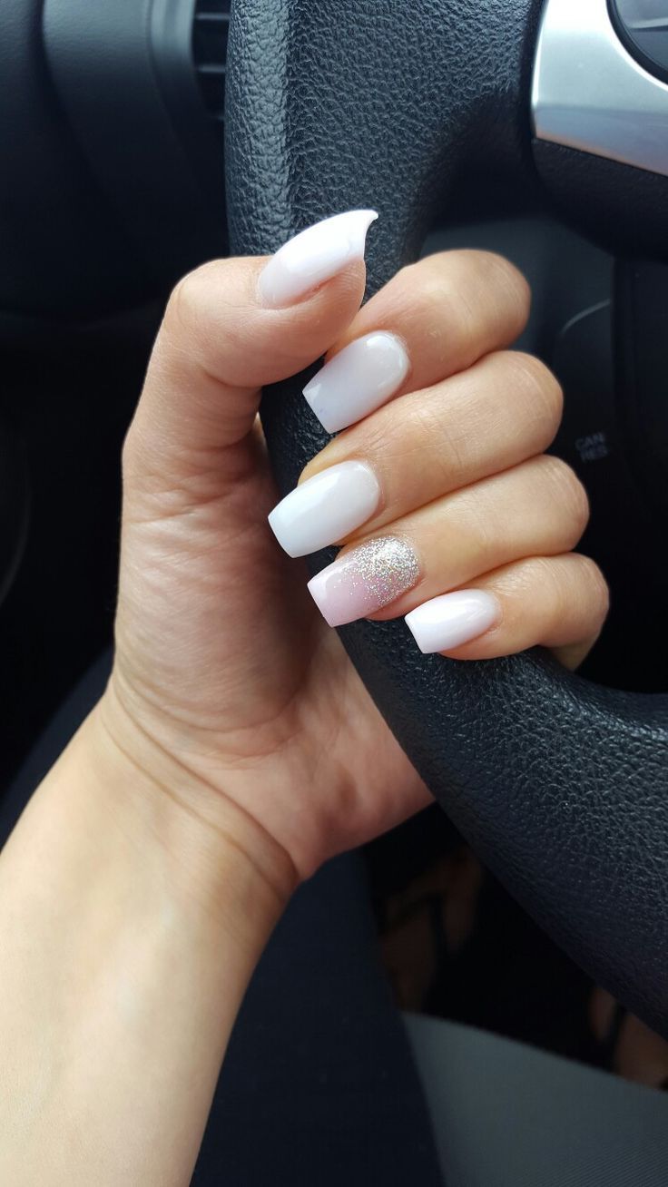 Chic Glossy White Acrylic Nails with Playful Glitter Accent