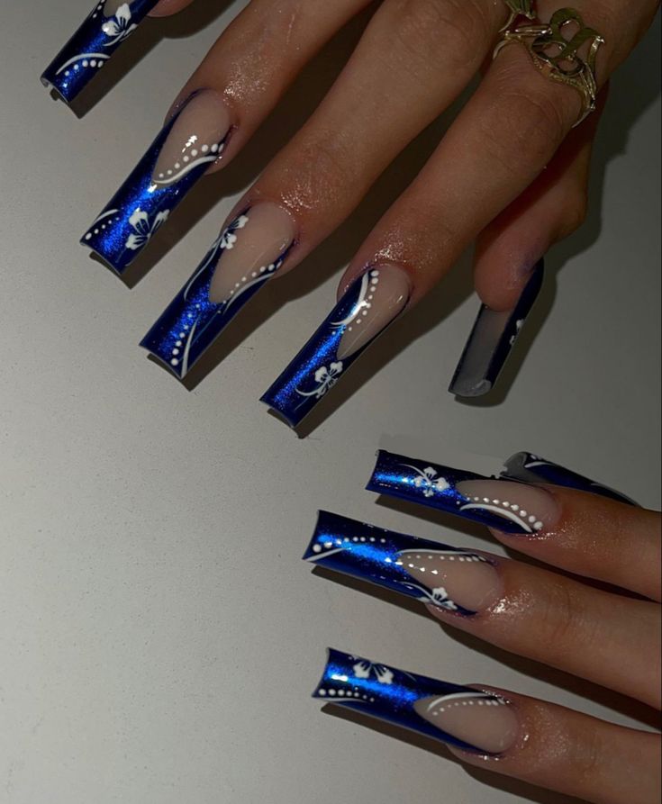 Elegant Striking Blue Floral Nail Art in Long, Tapered Design.