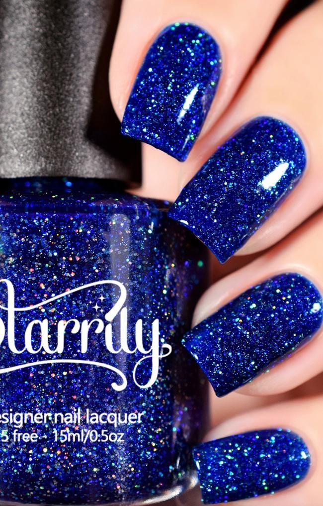 Dazzling Royal Blue Nail Polish: A Bold Statement with Shimmering Sparkle.